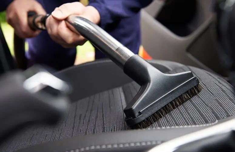 vacuuming a car