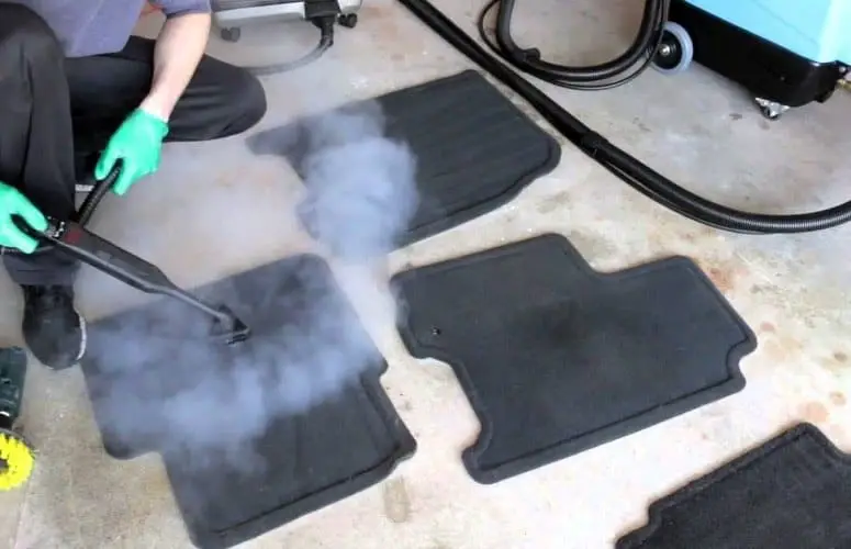 cleaning a car floor mat