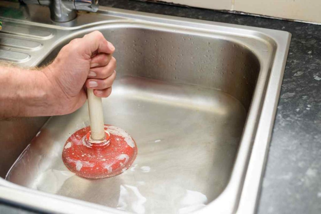 How to stop water from coming up kitchen sink.