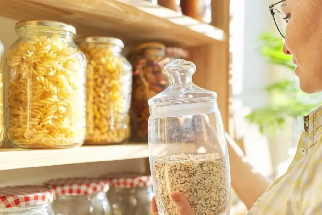 Glass containers in pantry.